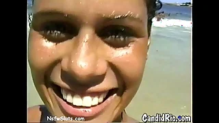 Latina in Bikini Flashes Bosom at Beach